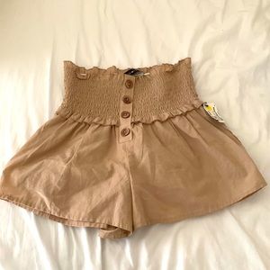 Cute tan shorts buttoned (fake buttons)